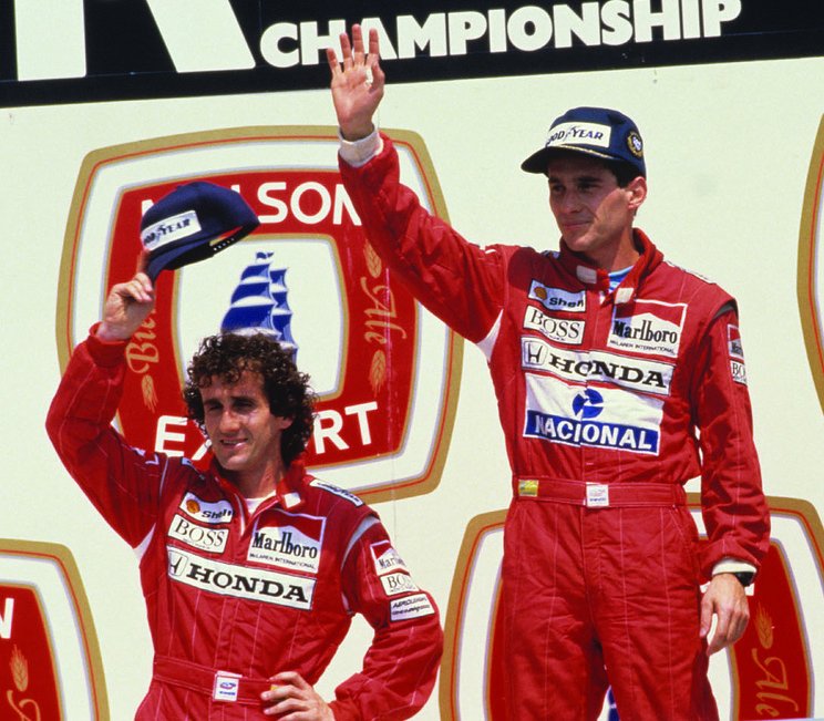 Senna_and_Prost_on_the_podium,_Montreal_1988_(Cropped)